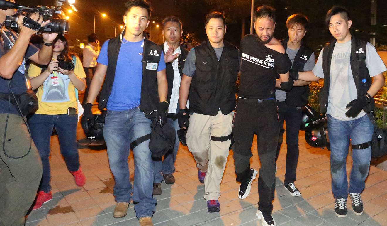 Tsang in custody on the night of the attack. Photo: Nora Tam