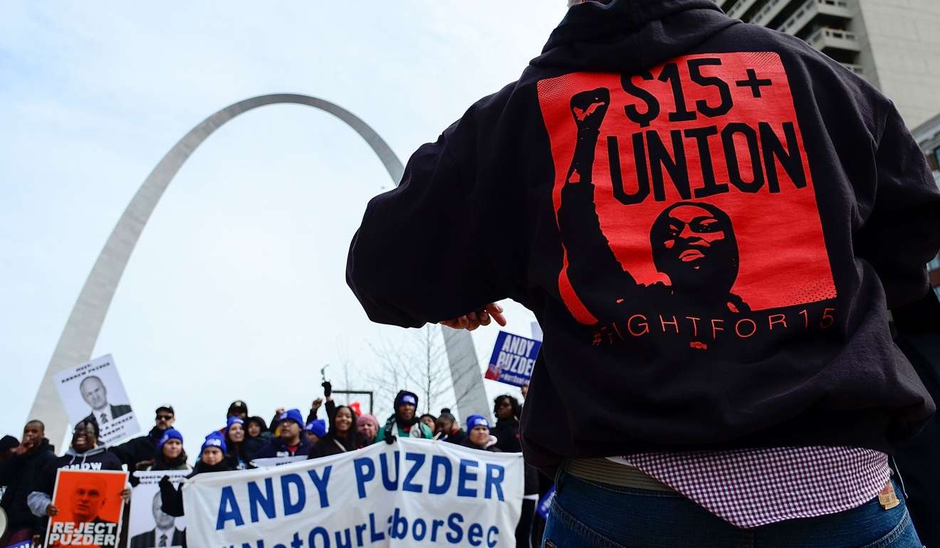 Protesters rally against Labor nominee Andrew Puzder outside of a Hardee's restaurant on February 13, 2017 in St Louis, Missouri. Photo: AFP