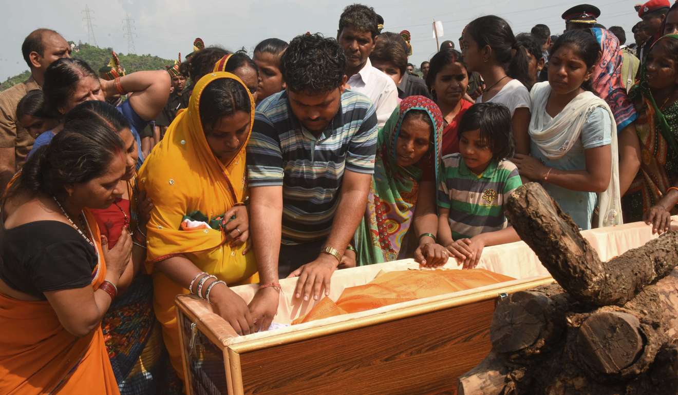 Indian relatives of army soldier Sunil Kumar Vidyarthi, who died in a gunbattle in Indian-administered Kashmir, surround his coffin during his funeral in his hometown of Gaya on September 20.Photo: AFP