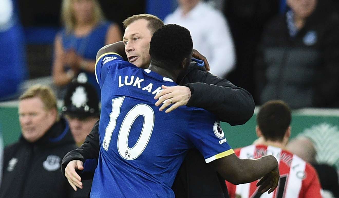Everton's Belgian striker Romelu Lukaku (R) hugs Everton coach Duncan Ferguson (L) at the end of the game after drawing level with the Scot’s Premier League goalscoring record. Photo: AFP