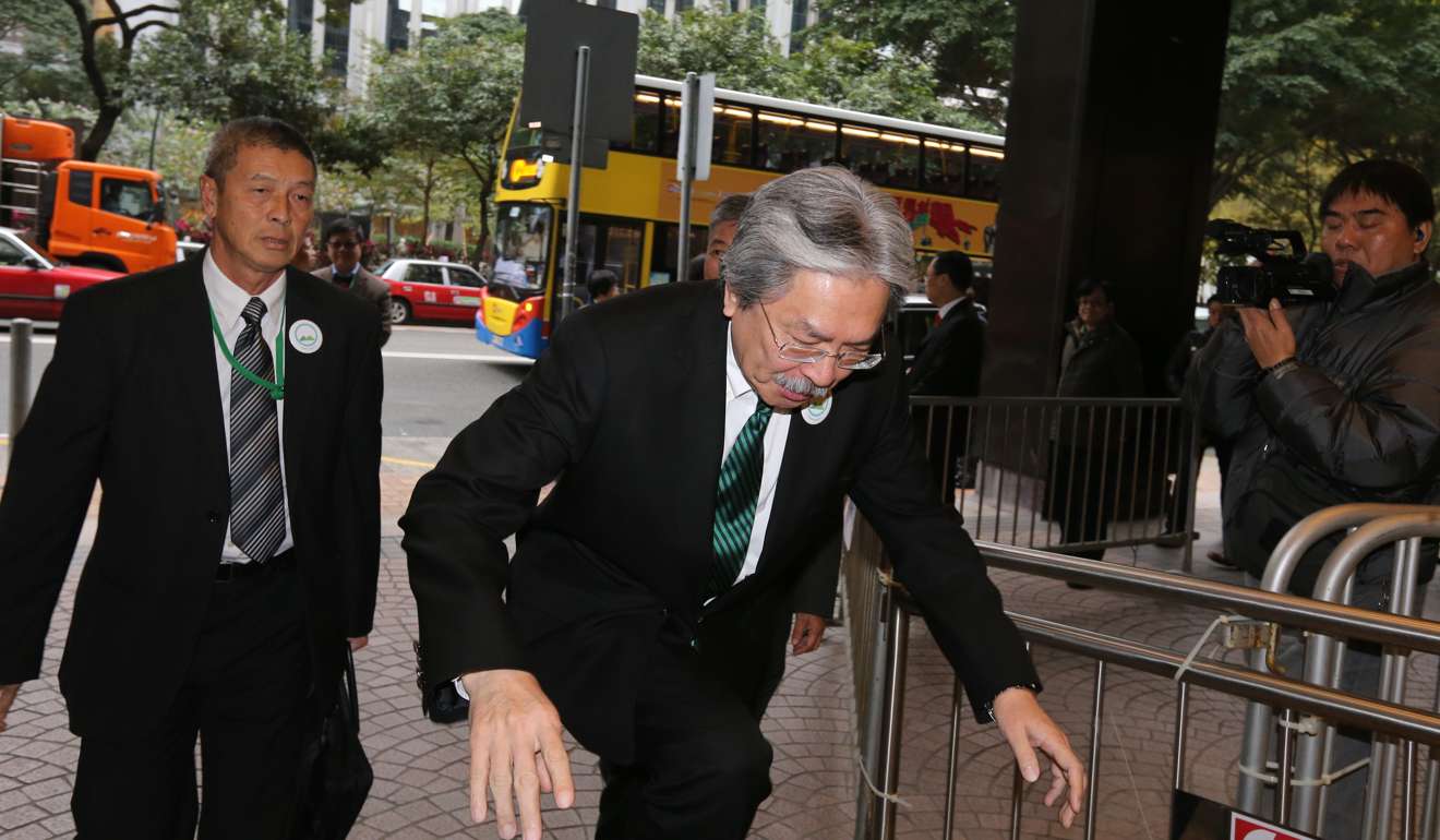 John Tsang almost loses his footing as he arrives at the electoral office. Photo: Dickson Lee