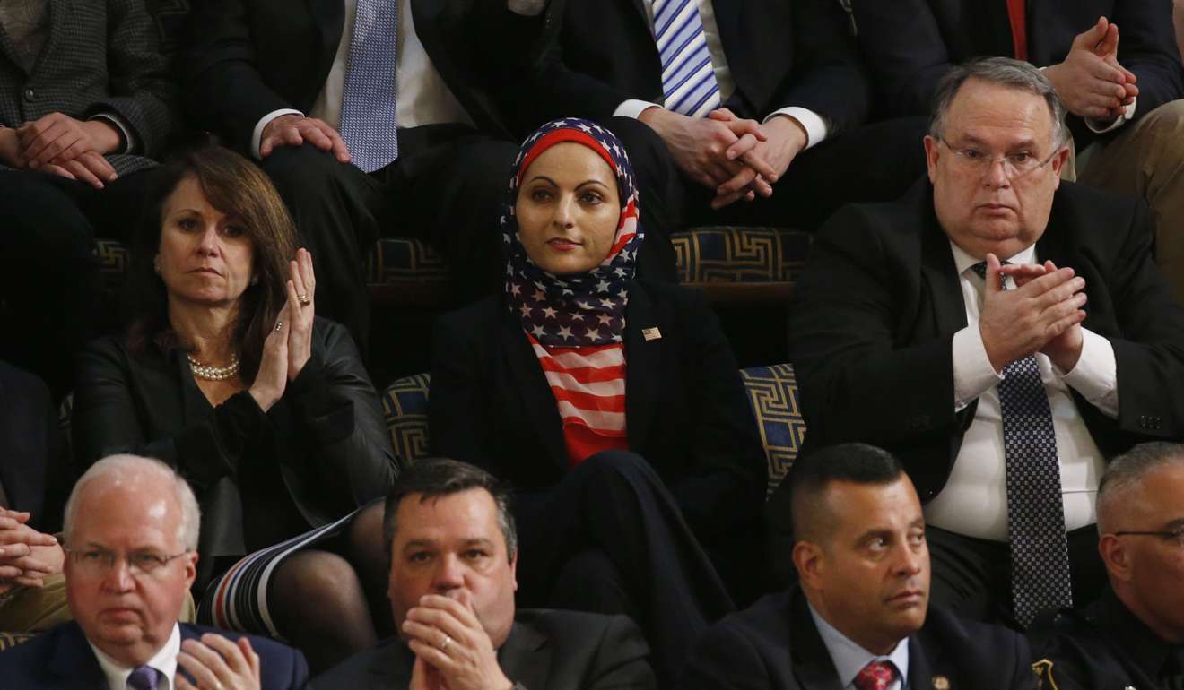 An audience member wears an American flag hijab. Photo: Reuters
