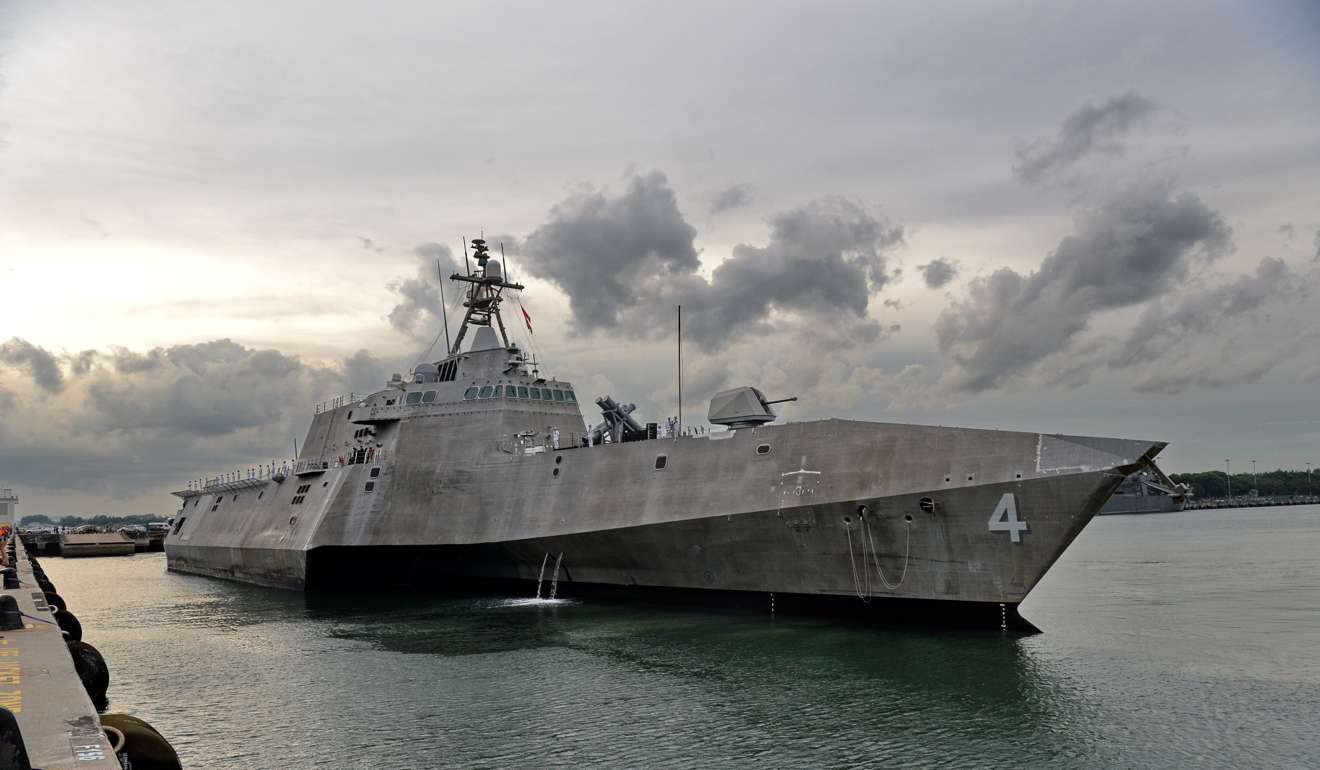 The US Navy’s USS Coronado is guided by pilot boats (unseen) as it docks at Changi Naval Base in Singapore. Photo: AFP