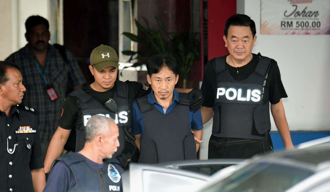 Ri Jong-chol, a North Korean man detained in connection with the fatal poisoning of the estranged half-brother of North Korea's leader, is being transferred from a police facility in Kuala Lumpur. Photo: Kyodo