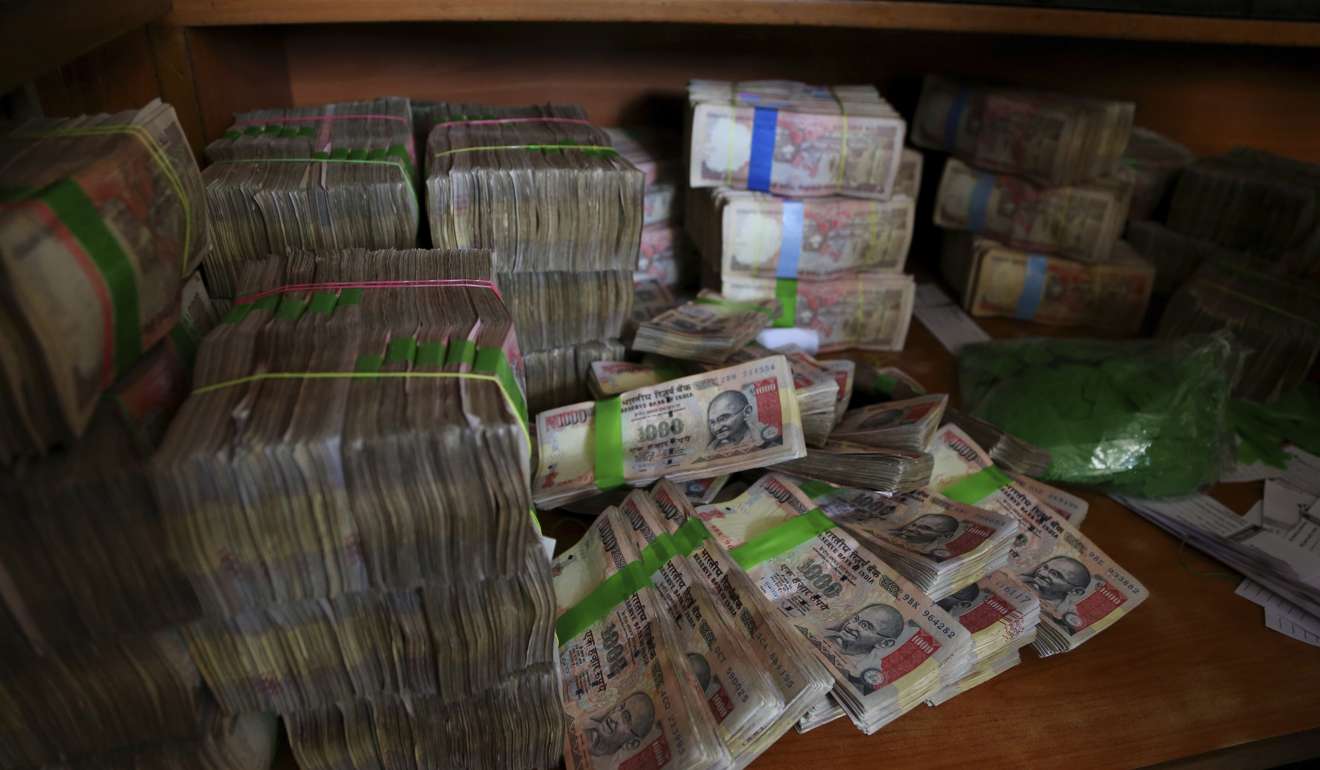 Discontinued Indian currency notes of 1,000 denomination are seen after they were exchanged at a bank in Bangalore, India, last November, in a government effort to crack down on corruption by banning high-denomination currency notes.Photo: AP