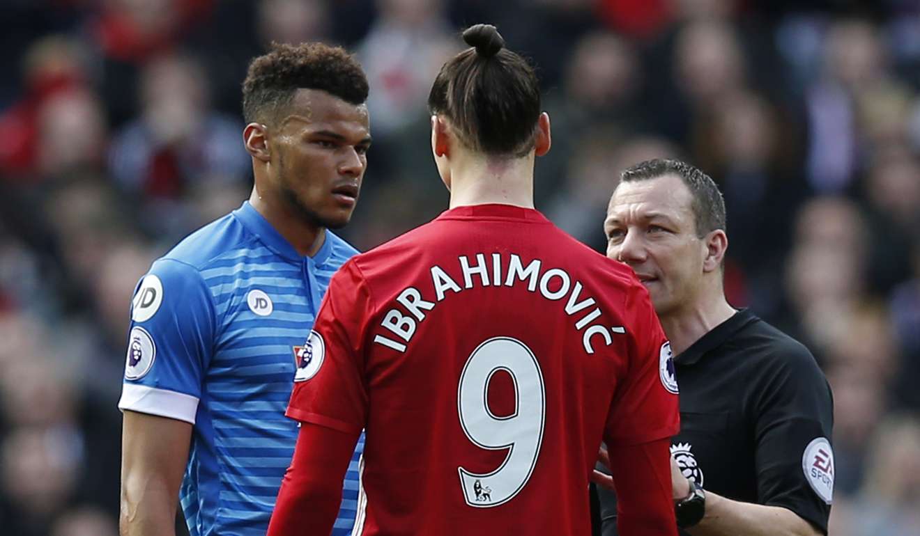 Zlatan Ibrahimovic and Bournemouth's Tyrone Mings have a chat with referee Kevin Friend. Photo: Reuters