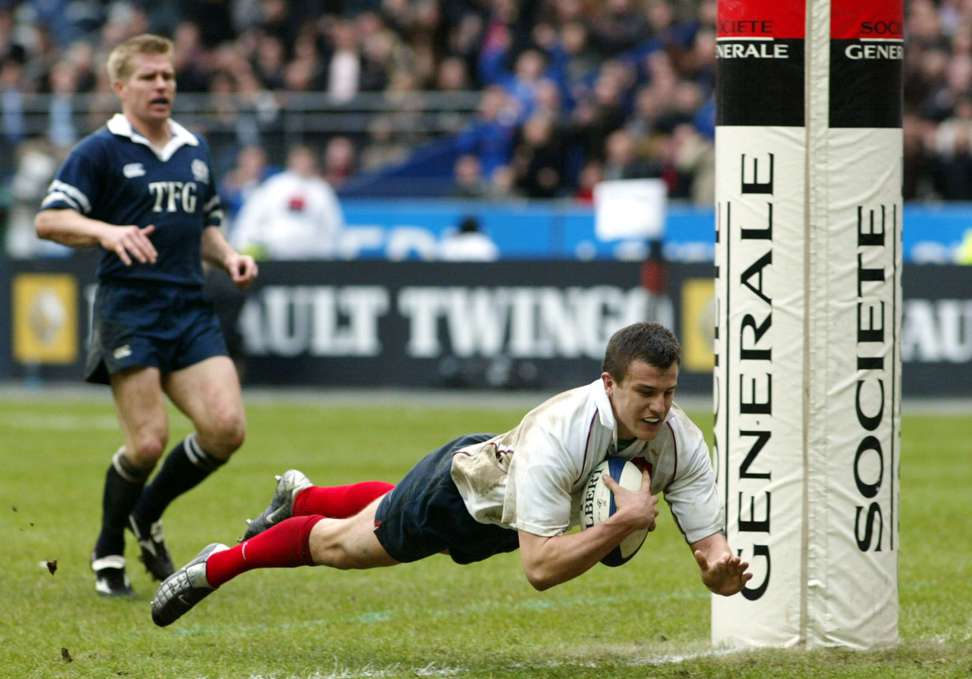 France's Damien Traille scores a try against Scotland during the 2003 Six Nations. Photo: AP