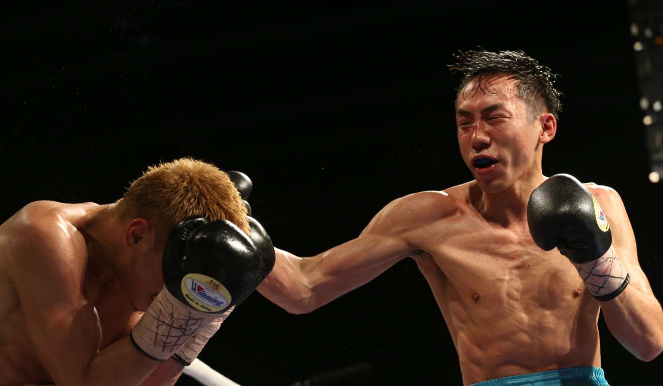 Rex Tso delivers a right hand against Hirofumi Mukai.