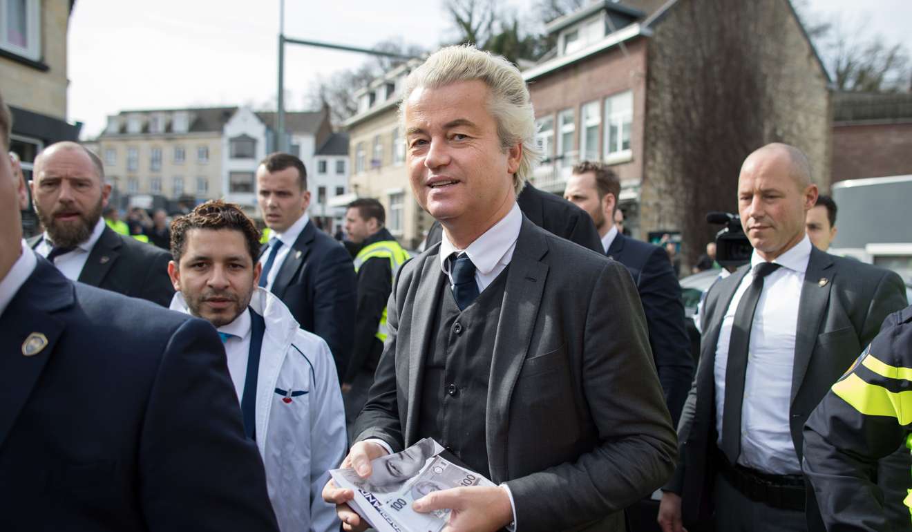 Geert Wilders carries election leaflets while campaigning in Valkenburg, Netherlands, on Saturday. Photo: Bloomberg