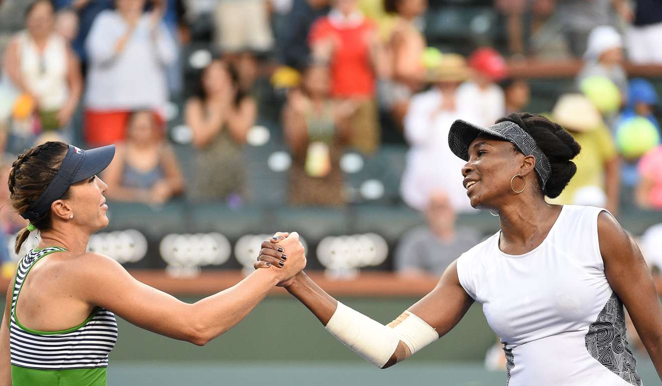 Venus Williams is congratulated at the net by Jelena Jankovic after their second-round match. Photo: AFP