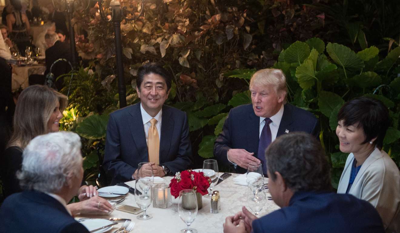US President Donald Trump (right) and Japanese Prime Minister Shinzo Abe sit down for dinner at Trump's Mar-a-Lago resort on February 10, 2017. Photo: AFP