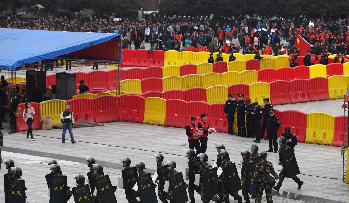 Security before the game at He Long Stadium. Photo: AFP