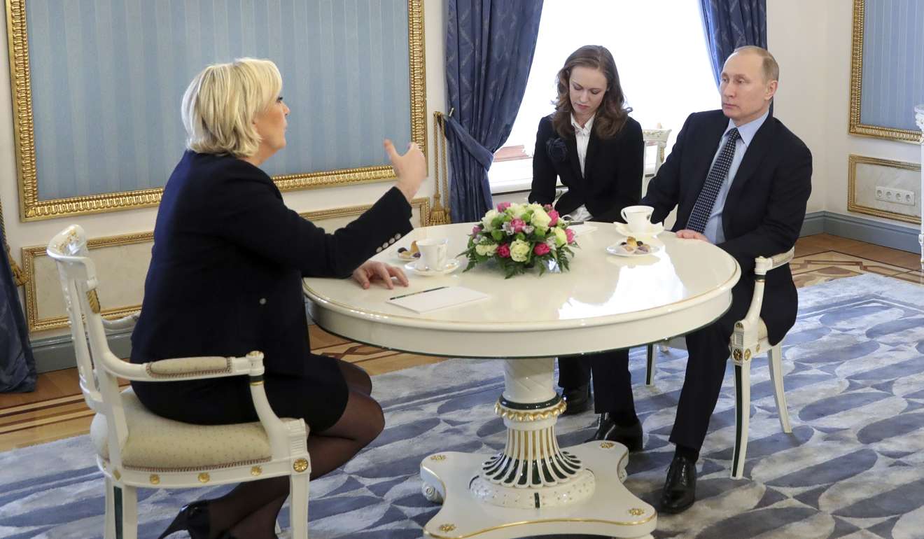French far-right presidential candidate Marine Le Pen, speaks to Russian President Vladimir Putin. Photo: AP