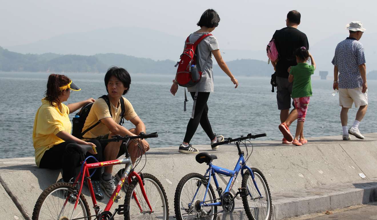 Cyclists take a rest at Plover Cove Reservoir, Tai Mei Tuk, Tai Po, but on Hong Kong Island it is harder to find places to ride.