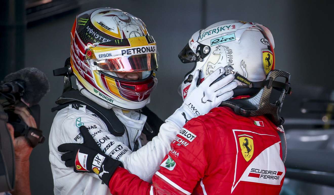 Lewis Hamilton congratulates winner Sebastian Vettel after winning the 2017 Australian Grand Prix. Photo: EPA