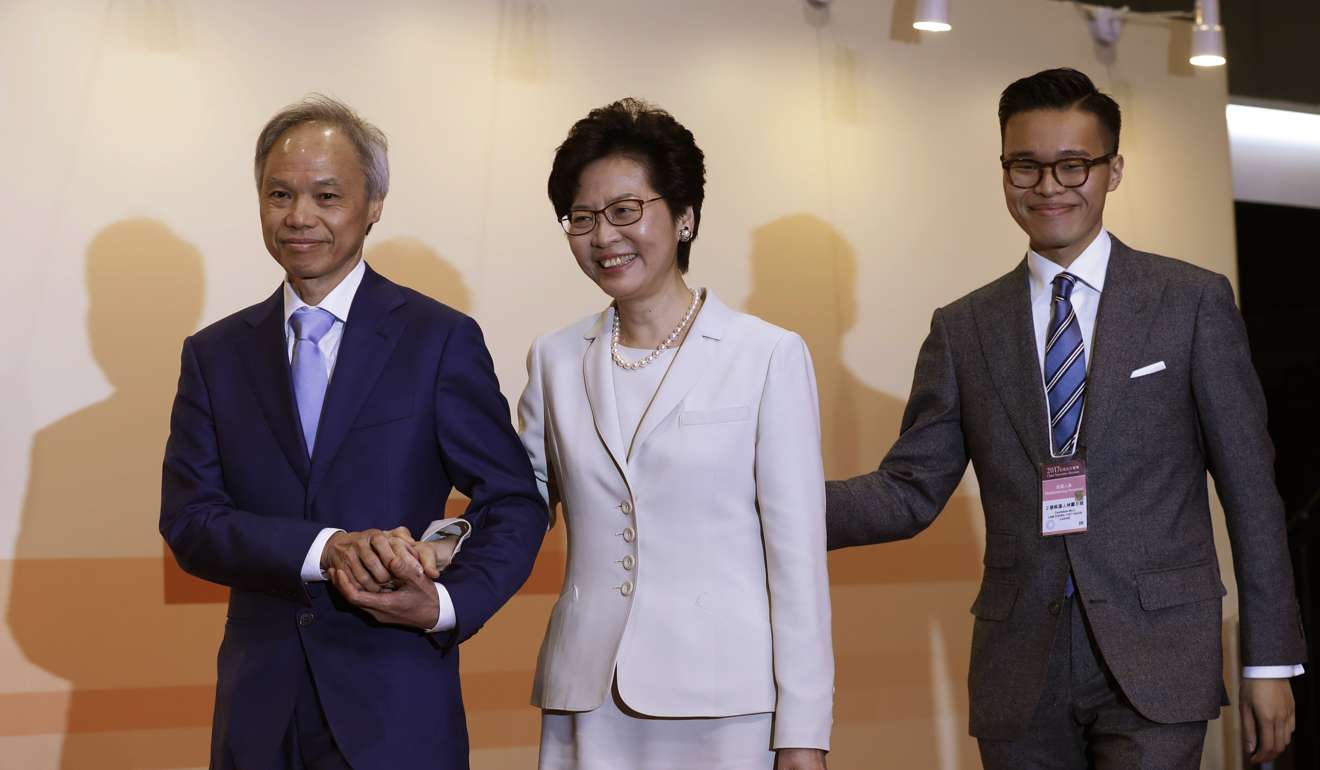 Carrie Lam, her husband Lam Siu-por and son Jeremy Lam arrive for a press conference after she won 777 Election Committee votes to become the next chief executive of Hong Kong, on March 26. Photo: AP