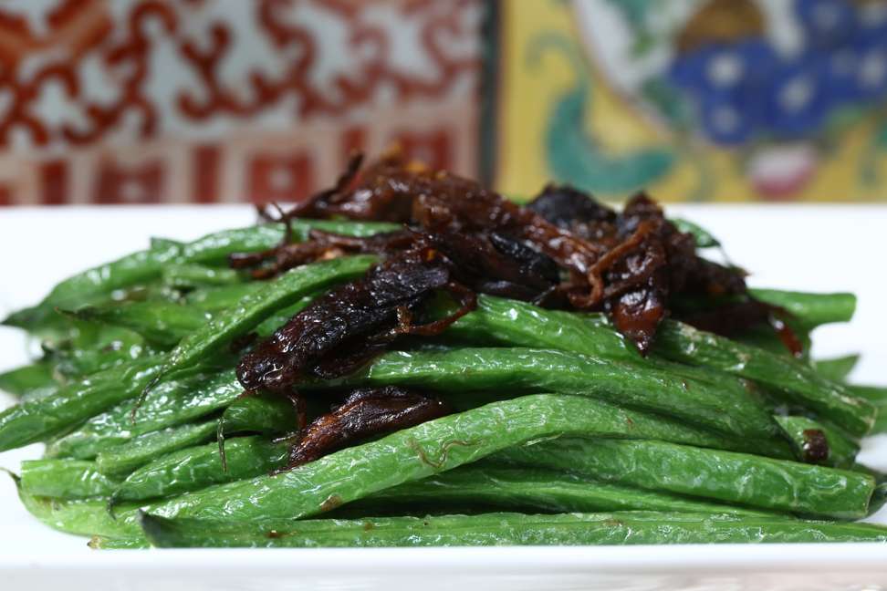 Wok-fried string beans with termite mushrooms. Photo: Jonathan Wong
