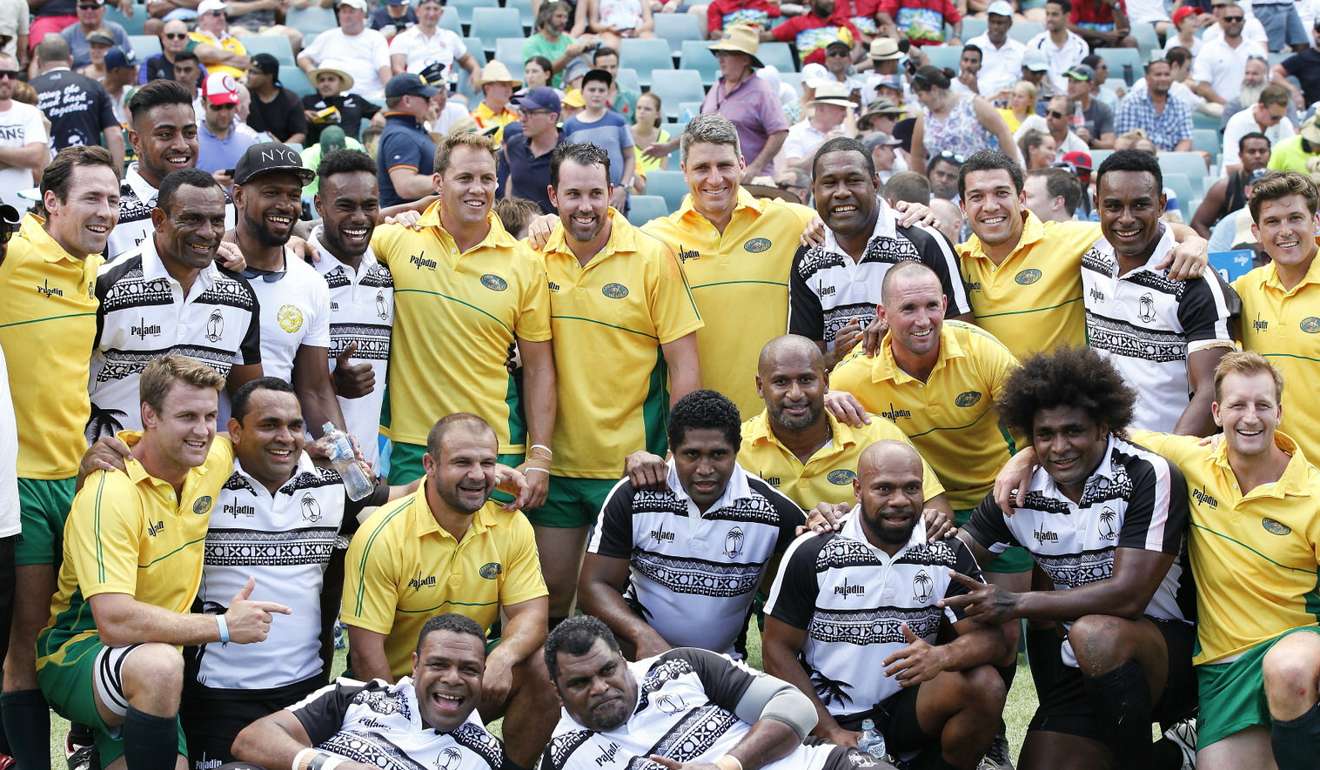 The Classic Wallabies and the Famous Fijians after their match at the Sydney Sevens. Photo: HKFC Tens