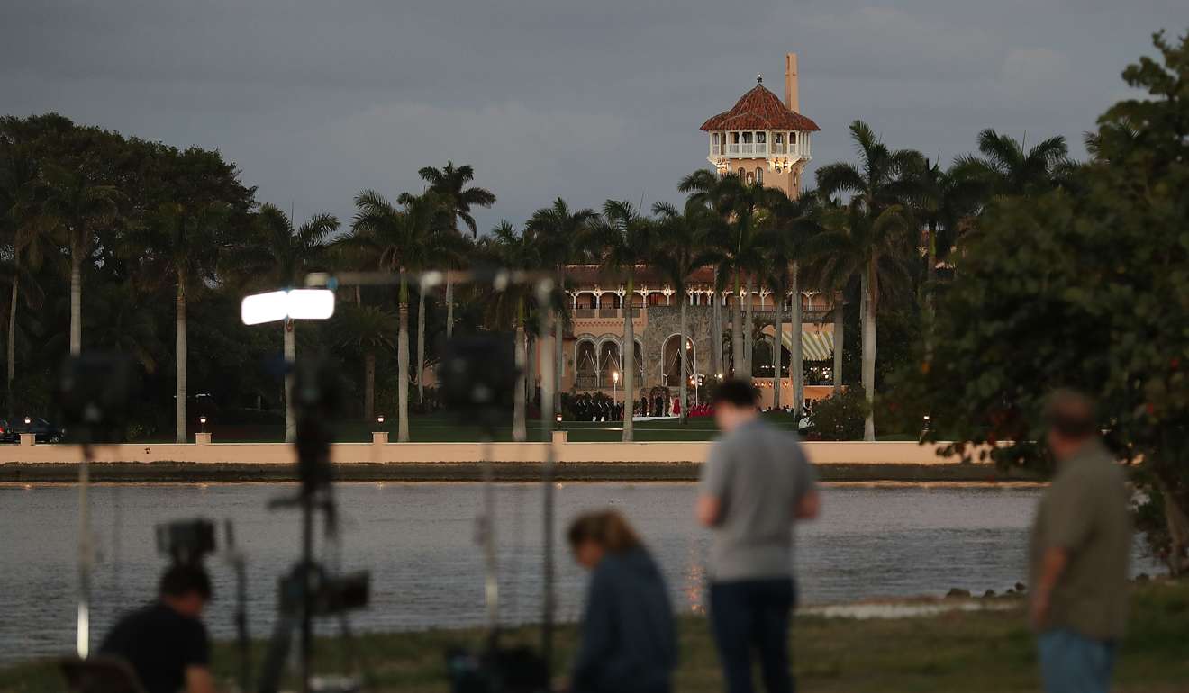 A television news crew sets up in front of the Mar-a-Lago Resort. Photo: AFP