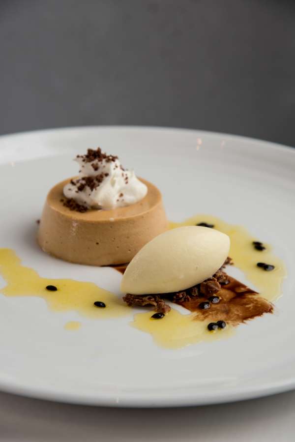 Hazelnut praline mousse with creme fraiche and passion fruit sorbet
