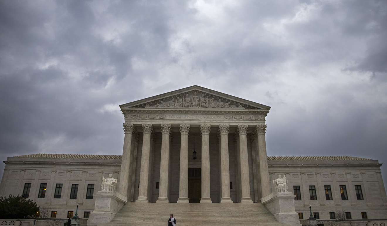 A general view of the Supreme Court under storm clouds as Senate Majority Leader Mitch McConnell led Republicans in changing Senate rules to confirm Supreme Court nominee Judge Neil Gorsuch. Photo: EPA