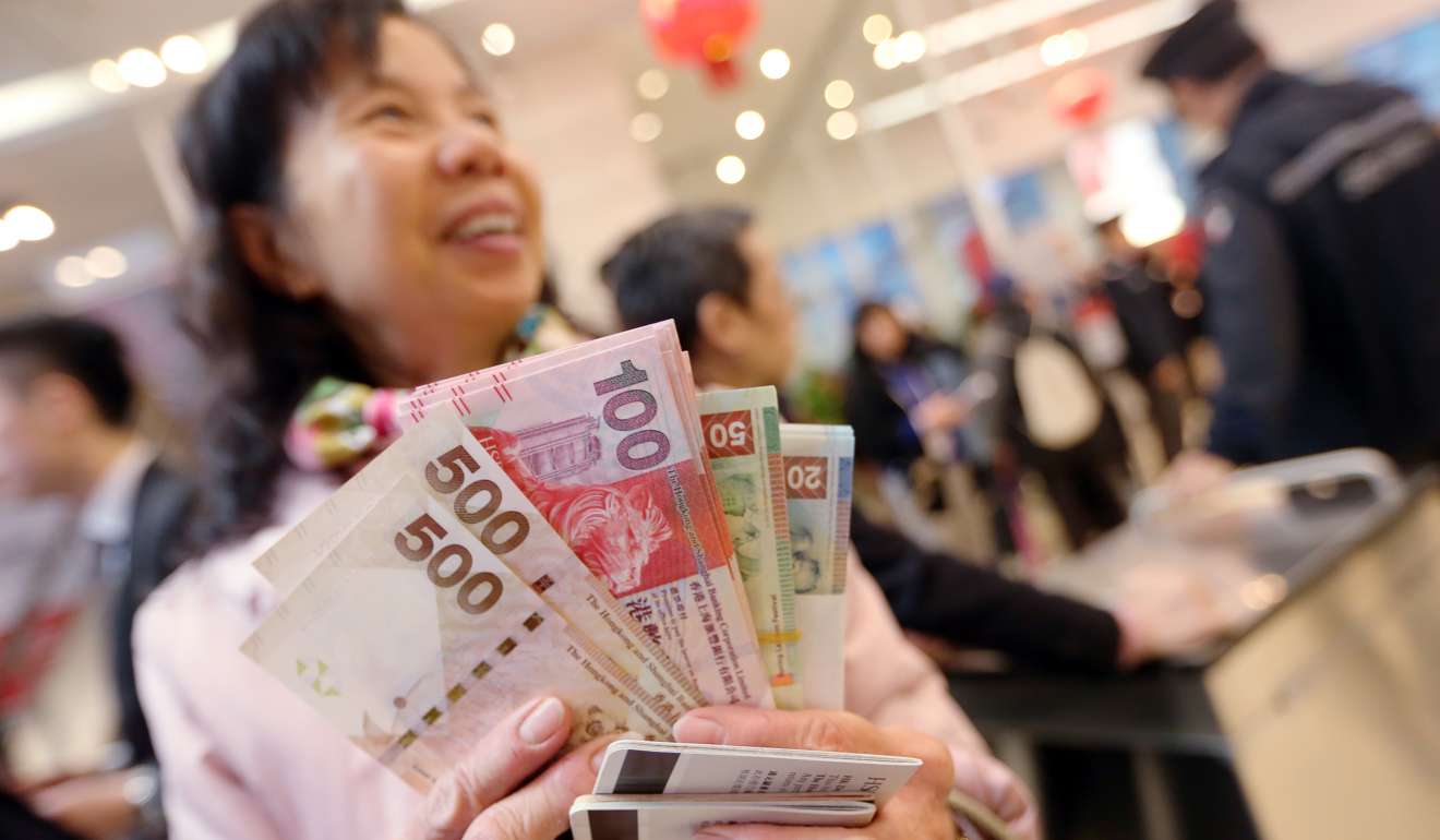 In a poll of business executives in China and Hong Kong conducted last year by the London Business School and Hong Kong University, 62 per cent reckoned the Hong Kong dollar would simply be phased out eventually, as the renminbi internationalised. Photo: David Wong