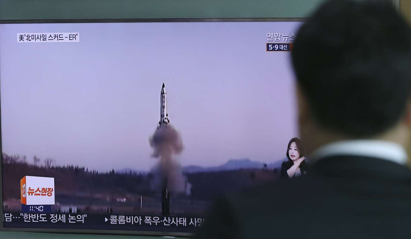 A man watches a TV news programme reporting about North Korea's missile firing with a file footage, at Seoul Train Station in Seoul, South Korea, Thursday, April 6, 2017. Photo: AP