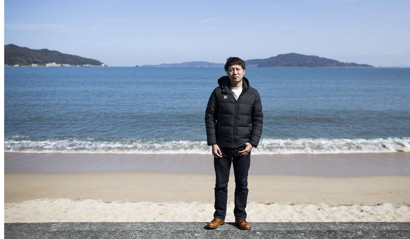 Kazz Watabe, chief executive officer of Umeebe, on a beach near his office in Fukuoka. Photo: Bloomberg