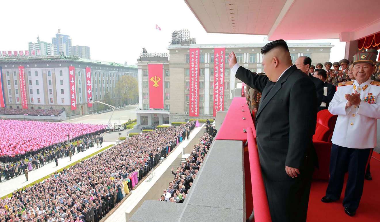 North Korean leader Kim Jong-un waves to people after a military parade in Pyongyang. Photo: AFP