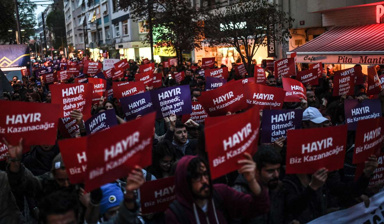Demonstrators chant slogans as they hold placards reading “No” in Turkish, during a march to protest the referendum results, in Kadikoy district of Istanbul on April 17. Photo: AFP