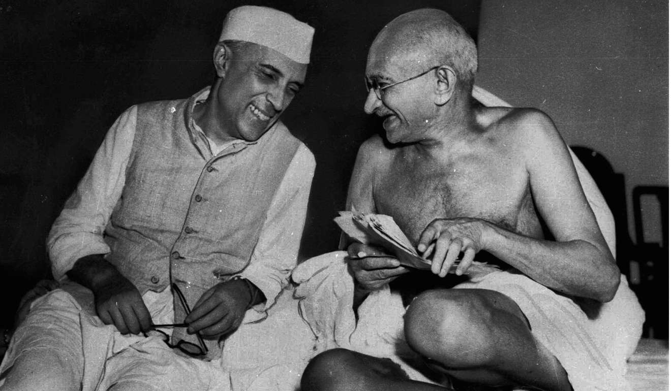 A bespectacled Mahatma Gandhi, right, who eventually led India to its independence, laughs with the man who was to be the nation's first prime minister, Jawaharlal Nehru, at the All-India Congress committee meeting in Bombay, India. Photo: AP