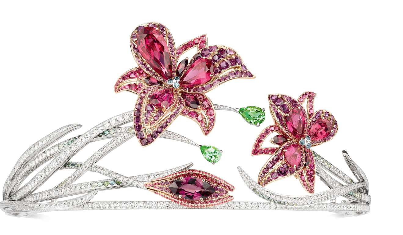 This tiara set with red spinels, rhodolite garnets, tourmalines and diamonds glitters in multiple forms. The two floral motifs can be worn as brooches and one of them can be attached to a necklace, HK$8.093 million