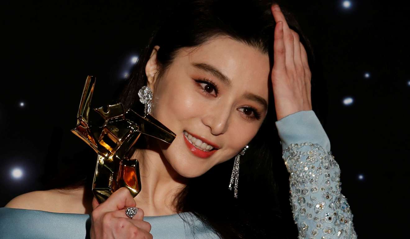 Fan Bingbing celebrates with her Best Actress award at the Asian Film Awards. Photo: Reuters