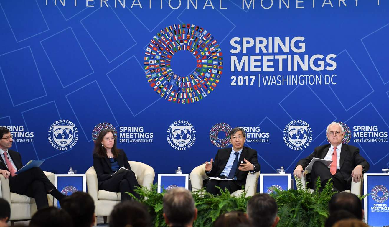 Yi Gang (C), deputy governor of the People's Bank of China (PBOC), speaking at a forum during the International Monetary Fund (IMF) and World Bank Spring Meetings in Washington. Photo: Xinhua