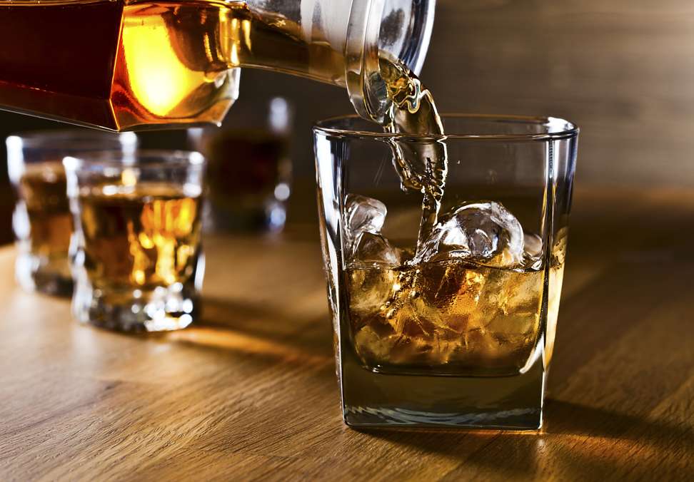 Enjoy a glass of whiskey with ice or a few drops of water. Photo: Shutterstock