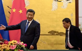 President Xi Jinping leads the way for his Philippine counterpart, Rodrigo Duterte, to a signing ceremony in Beijing on October 20. Photo: AP President Xi Jinping leads the way for his Philippine counterpart, Rodrigo Duterte, to a signing ceremony in Beijing on October 20. Photo: AP