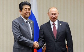 Russian President Vladimir Putin and Japanese Prime Minister Shinzo Abe shaking hands during a meeting on the sidelines of the Asia-Pacific Economic Cooperation Leaders' Meeting in Lima. Photo: AFP Russian President Vladimir Putin and Japanese Prime Minister Shinzo Abe shaking hands during a meeting on the sidelines of the Asia-Pacific Economic Cooperation Leaders' Meeting in Lima. Photo: AFP