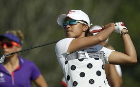 Tiffany Chan Tsz-ching of Hong Kong, watches her tee shot on the 4th hole during the first round of the women's golf event at the 2016 Summer Olympics in Rio de Janeiro, Brazil, Wednesday, Aug. 17, 2016. (AP Photo/Alastair Grant)