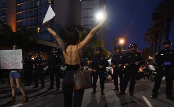 Anti-Trump protesters demonstrate outside the convention centre. Photo: AFP Anti-Trump protesters demonstrate outside the convention centre. Photo: AFP