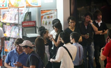 People drinking outside a 7-Eleven in Lan Kwai Fong.Photo: K. Y. Cheng