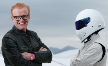 Chris Evans, left, standing with Top Gear’s racing driver, “The Stig”. Evans has announced he is standing aside host of the show. Photo: AP
