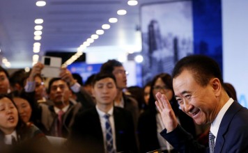 Wang Jianlin, chairman of Dalian Wanda Group, speaks to the media after attending the Asian Financial Forum in Hong Kong in January. His company has made it into the Fortune 500 for the first time. Photo: Nor Tam, SCMP