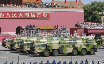 Military vehicles carry DF-16 ballistic missiles in Tiananmen Square last September. Photo: Imaginechina