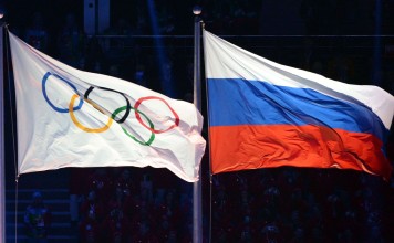 This file photo taken on February 7, 2014 shows the Olympic and Russian flags during the Opening Ceremony of the Sochi Winter Olympics. AFP This file photo taken on February 7, 2014 shows the Olympic and Russian flags during the Opening Ceremony of the Sochi Winter Olympics. AFP