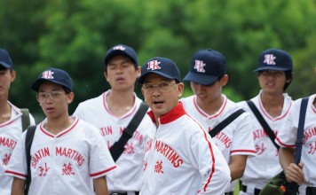 Liu Kai-chi (centre) as the school principal and baseball team coach in Weeds on Fire.