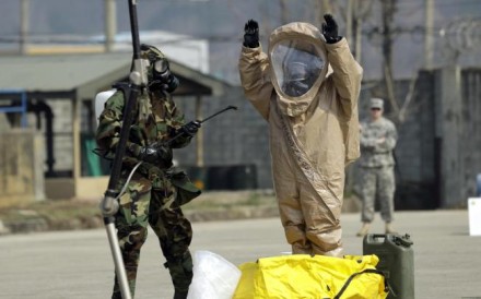 US soldiers wearing anti-chemical suits perform a drill at their base north of Seoul. Photo: AP US soldiers wearing anti-chemical suits perform a drill at their base north of Seoul. Photo: AP