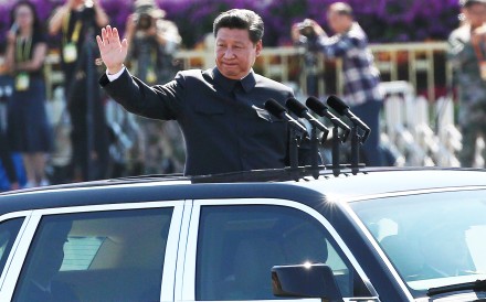 President Xi Jinping waves from a car as he reviews troops on Tiananmen Square during the military parade. Photo: EPA President Xi Jinping waves from a car as he reviews troops on Tiananmen Square during the military parade. Photo: EPA