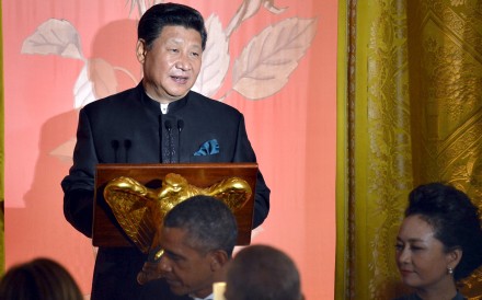 Chinese President Xi Jinping speaks as his wife Madame Peng Liyuan and US President Barack Obama listen during a state dinner at the White House in Washington on Friday. Photo: Reuters