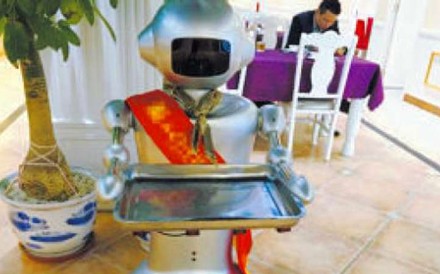 The use of four robot waiters in one restaurant in the city of Xiamen made national headlines. Photo: Xiamen Daily