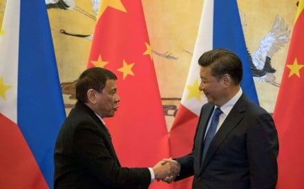 Philippine President Rodrigo Duterte and Chinese President Xi Jinping shake hands after a signing ceremony in Beijing. Photo: Reuters